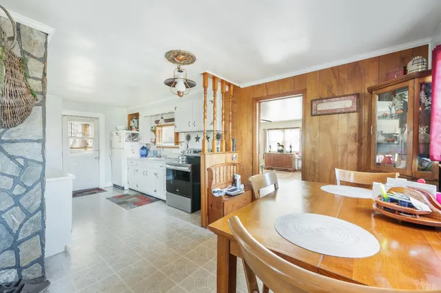 a kitchen with granite countertop cabinets stainless steel appliances and a counter space