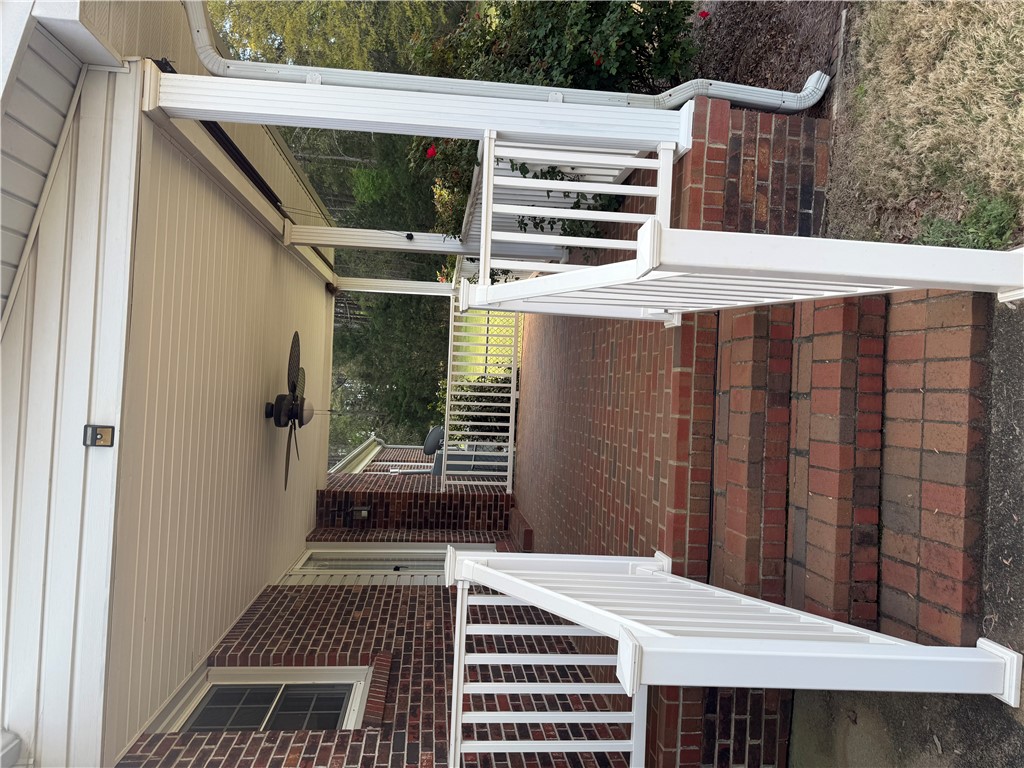121 Nautical Way Anderson, SC 29625 - Photo 9 of 37 A welcoming front porch features classic brick flooring, inviting you to relax outdoors.