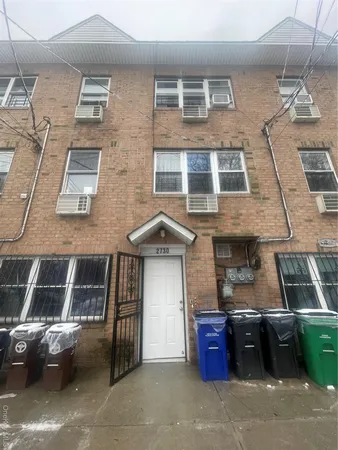 a front view of a house with parking space