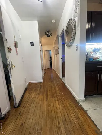 a room with a bed and a mirror