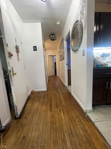 a room with a bed and a mirror