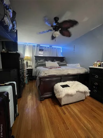 a bed room with a bed and a chair