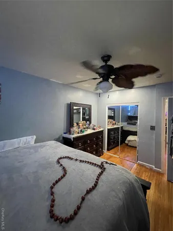 a bathroom with a granite countertop toilet sink and mirror