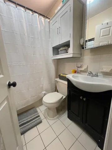 a kitchen with granite countertop a stove and a refrigerator