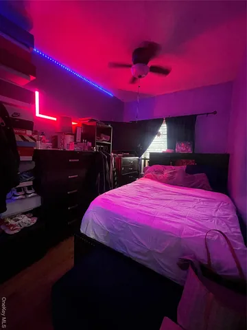 a living room with kitchen island furniture and a wooden floor