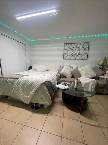 a bedroom with a bed and a table