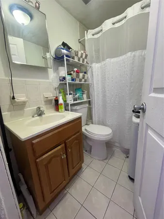 a bathroom with a sink toilet and vanity