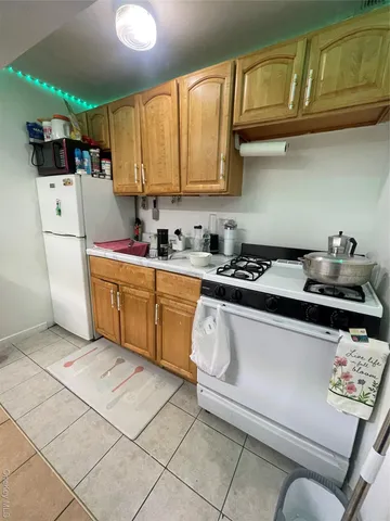a kitchen with stainless steel appliances granite countertop a sink dishwasher stove and cabinets