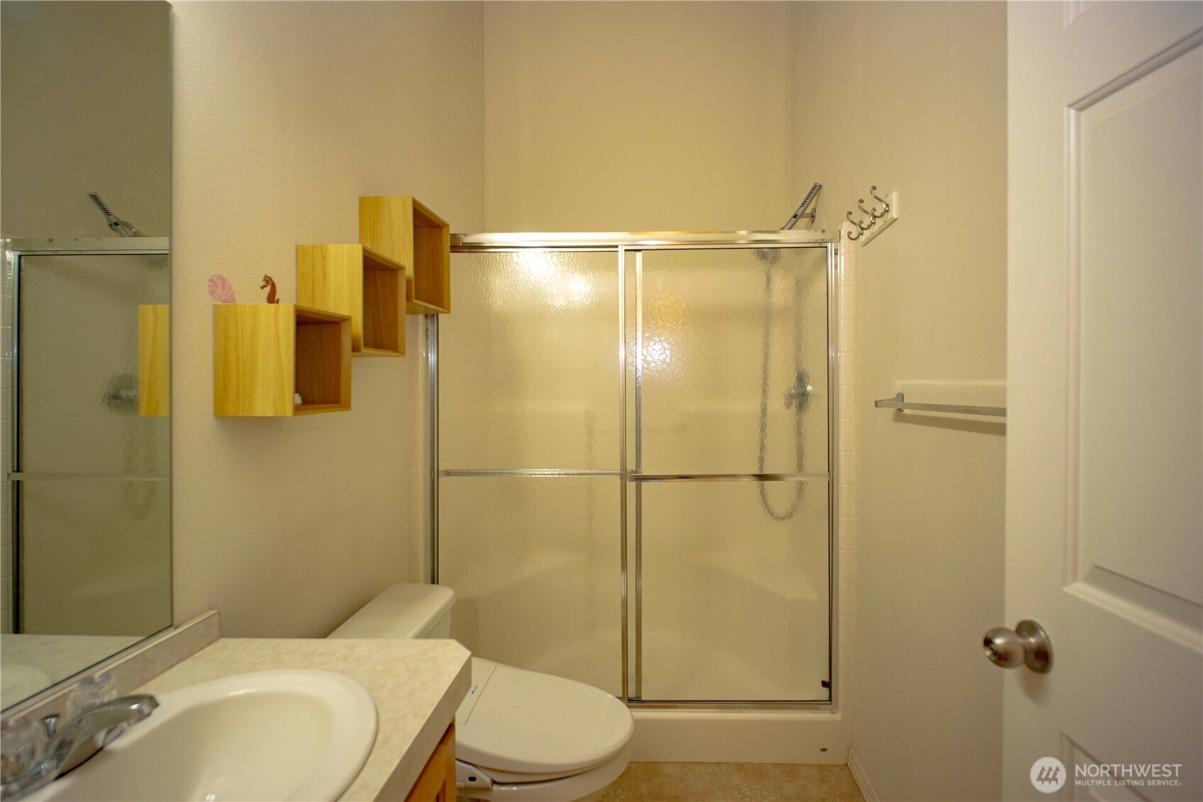 660 Elk Loop Sequim, WA 98382 - Photo 21 of 36 a bathroom with a sink toilet and shower
