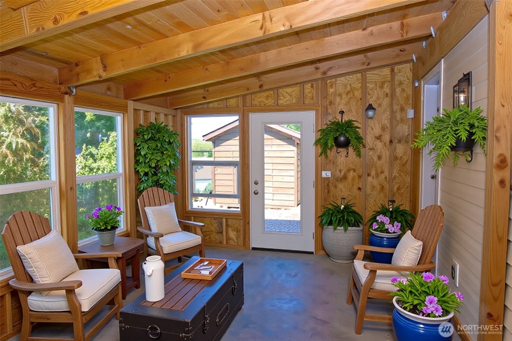 660 Elk Loop Sequim, WA 98382 - Photo 23 of 36 a living room with patio furniture and a potted plant
