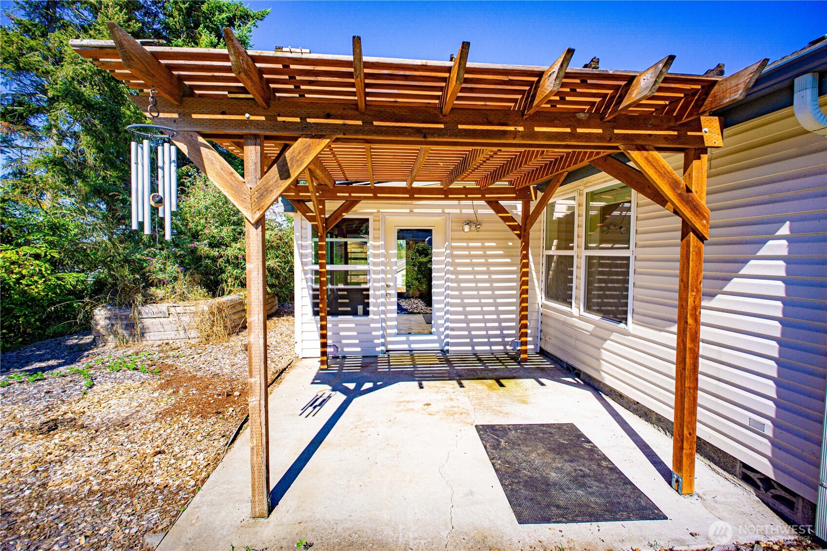 660 Elk Loop Sequim, WA 98382 - Photo 27 of 36 a view of a patio with a table and chairs