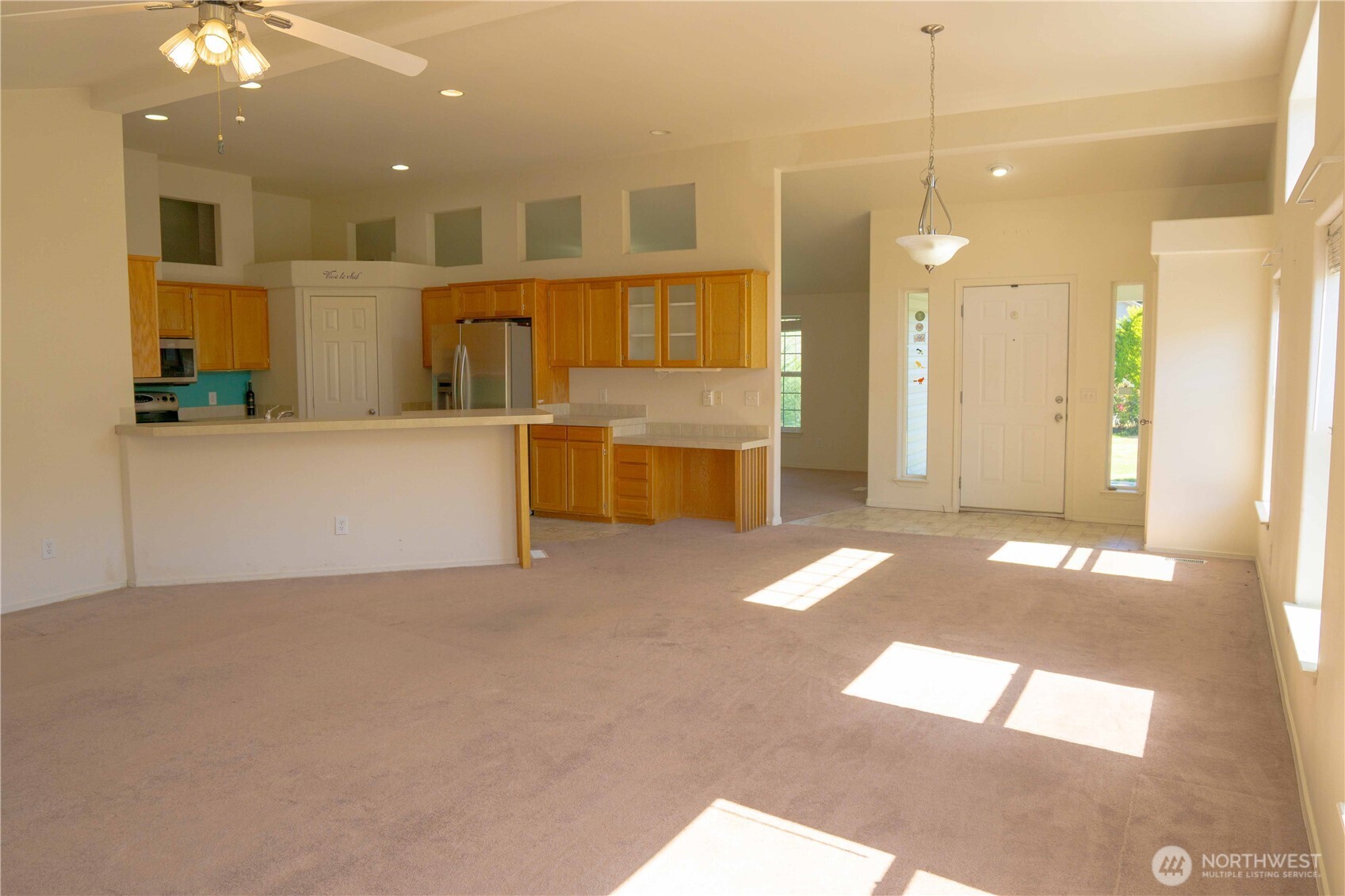660 Elk Loop Sequim, WA 98382 - Photo 7 of 36 a bathroom with a tub a sink and a large mirror