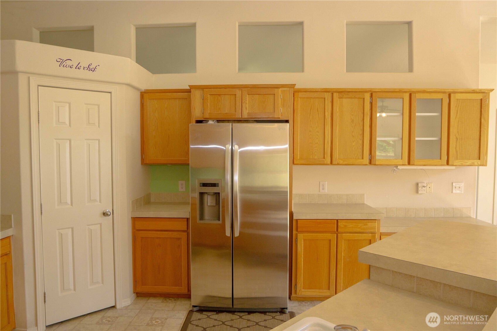 660 Elk Loop Sequim, WA 98382 - Photo 10 of 36 a bathroom with a sink and a refrigerator