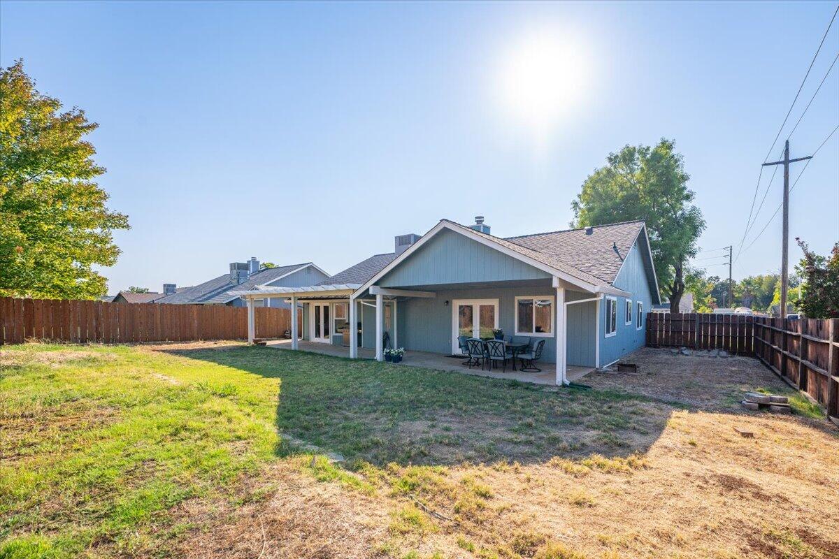 1543 Marigold Way Redding, CA 96003 - Photo 21 of 47 front view of a house with a yard