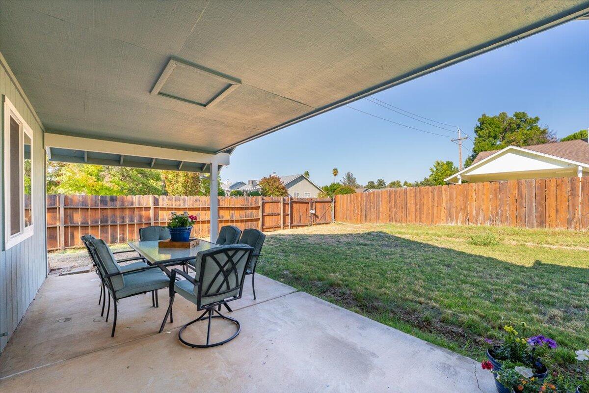 1543 Marigold Way Redding, CA 96003 - Photo 33 of 47 a view of a porch with furniture and yard