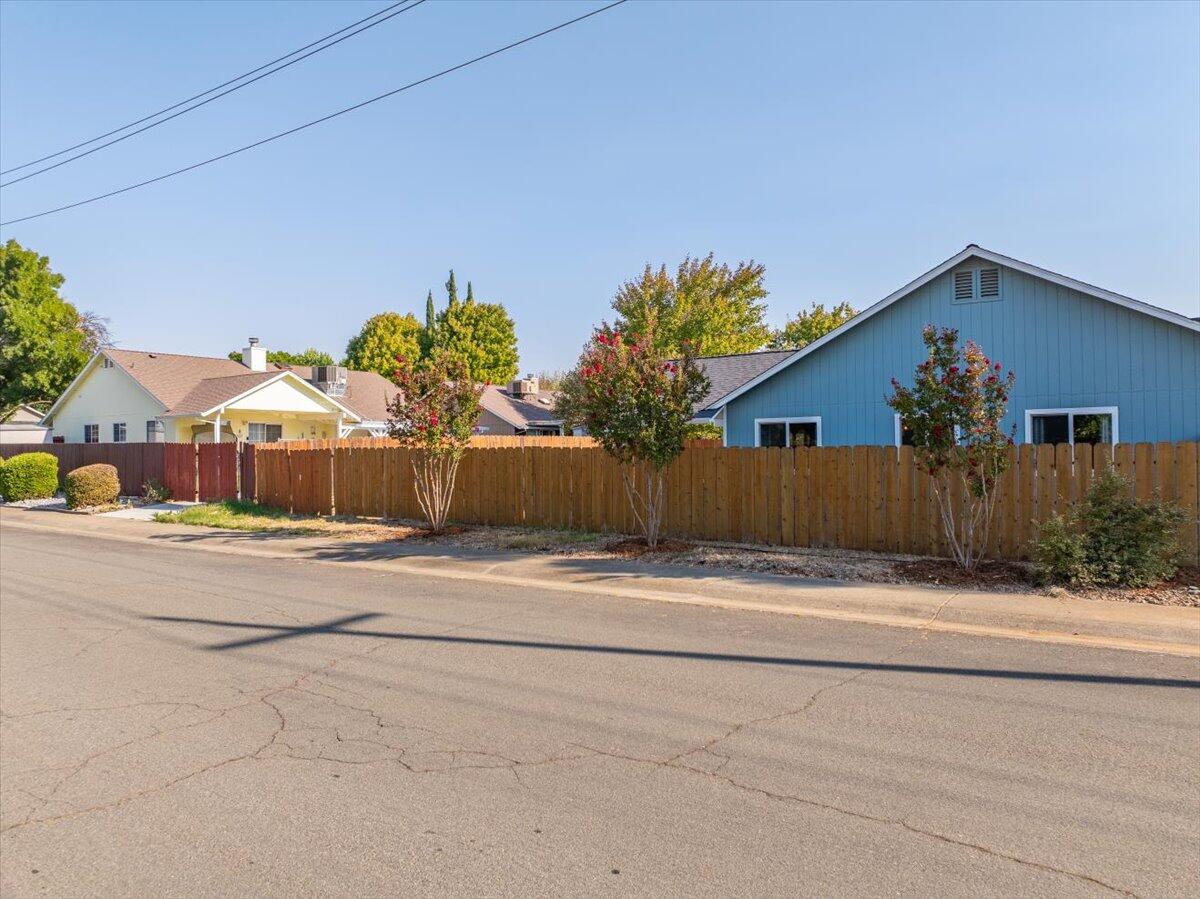 1543 Marigold Way Redding, CA 96003 - Photo 38 of 47 front view of a house with a yard