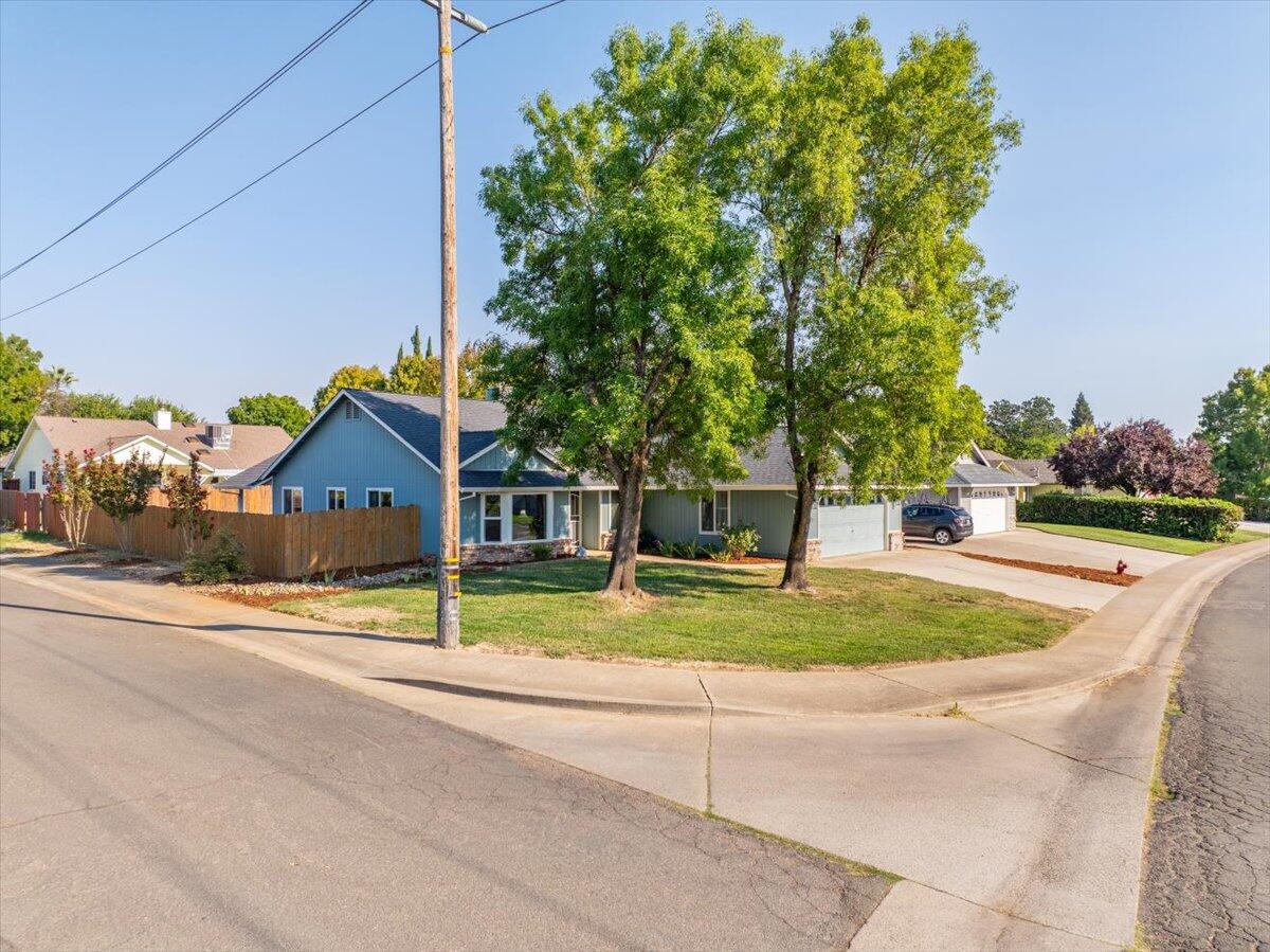 1543 Marigold Way Redding, CA 96003 - Photo 39 of 47 a house with trees in front of it