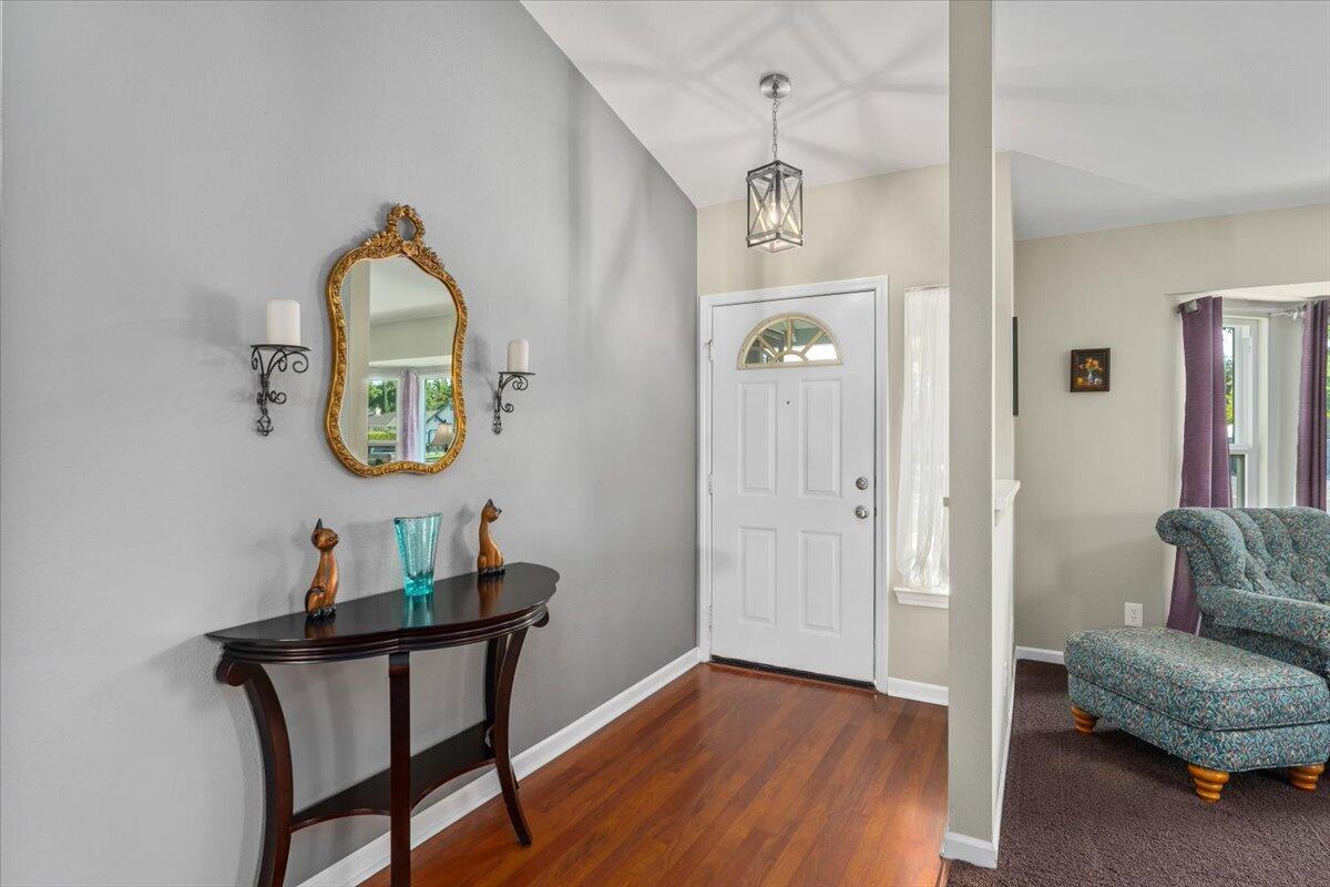 1543 Marigold Way Redding, CA 96003 - Photo 4 of 47 a view of a livingroom with furniture and wooden floor