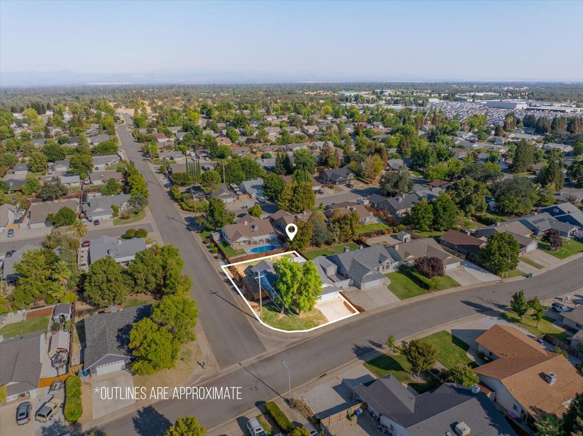 1543 Marigold Way Redding, CA 96003 - Photo 47 of 47 an aerial view of residential houses with outdoor space and swimming pool