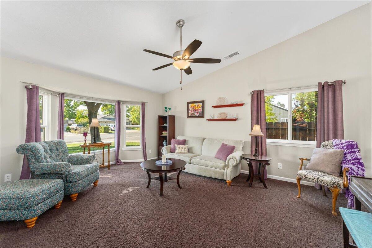 1543 Marigold Way Redding, CA 96003 - Photo 5 of 47 a living room with furniture and a large window