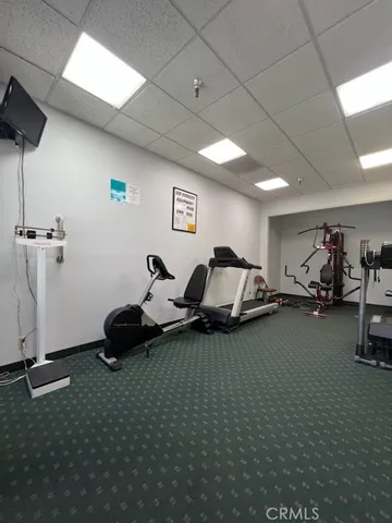 a view of a room with lots of furniture