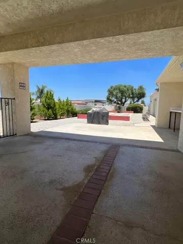 a outdoor living space with furniture and a ceiling fan