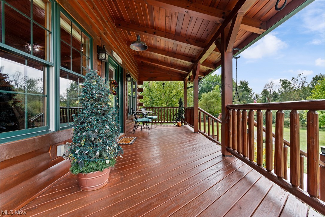 View of covered wooden front porch