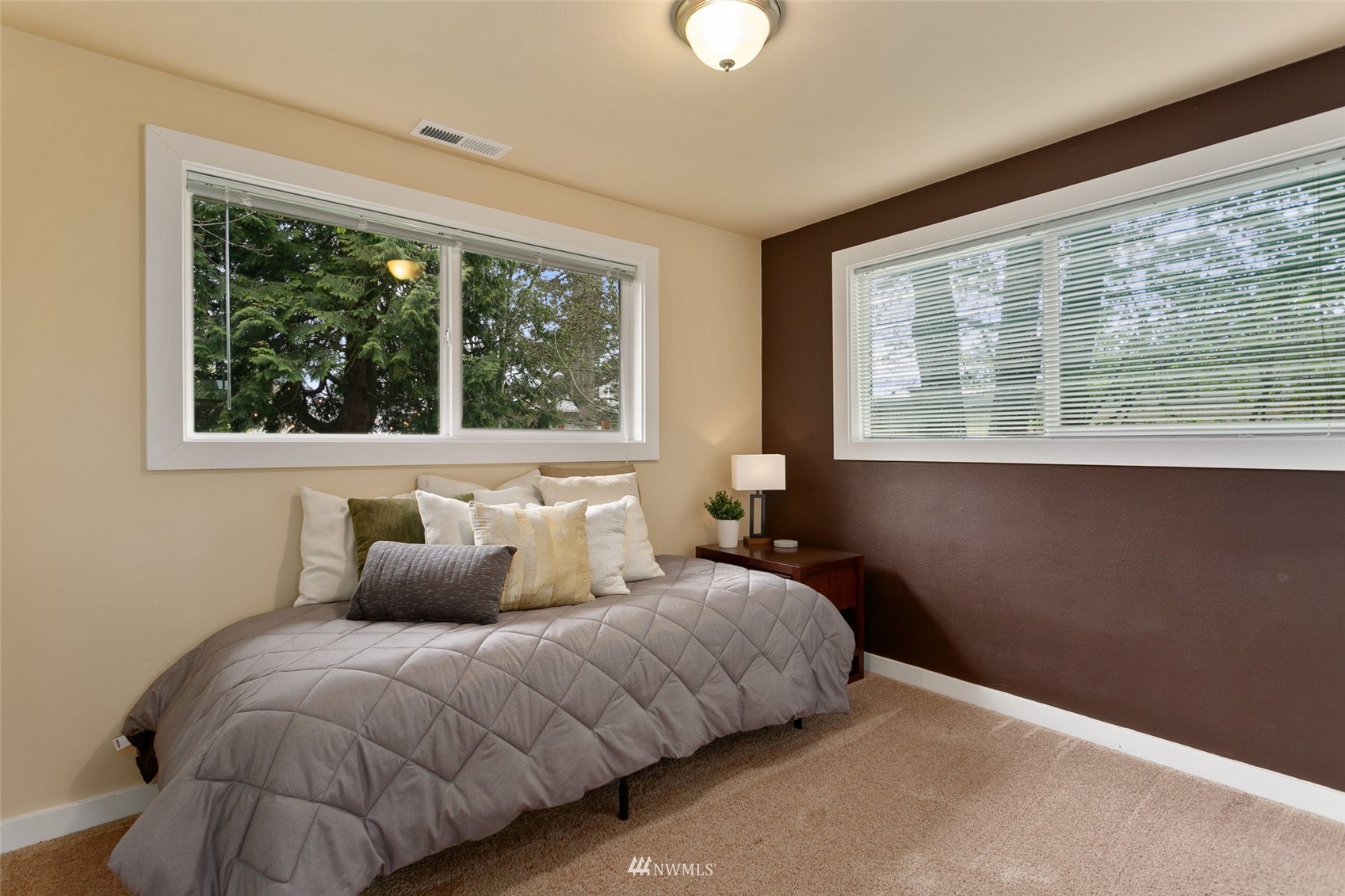 3523 Northeast 6th Street Renton, WA 98056 - Photo 14 of 27 a bedroom with a bed and a window