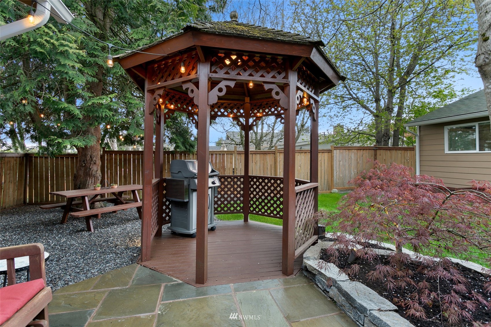 3523 Northeast 6th Street Renton, WA 98056 - Photo 20 of 27 a view of a chairs and table in the backyard
