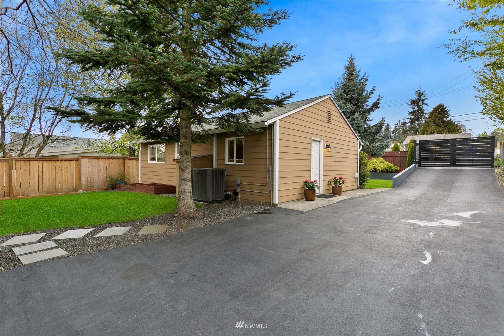 3523 Northeast 6th Street Renton, WA 98056 - Photo 26 of 27 a view of a house with a yard and garage