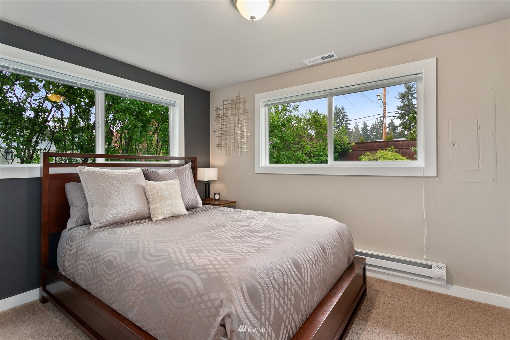 3523 Northeast 6th Street Renton, WA 98056 - Photo 9 of 27 a large bed sitting in a bedroom next to a window