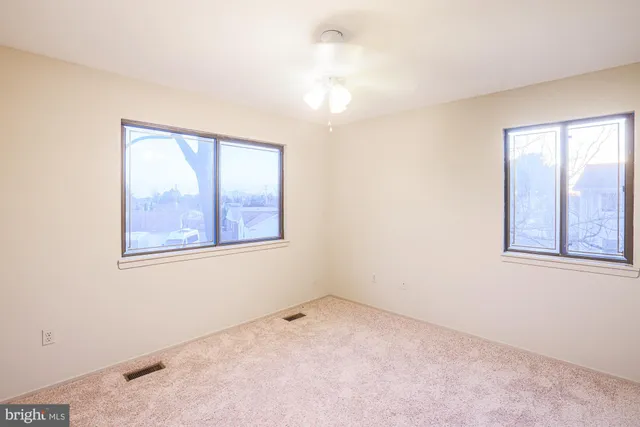 a white toilet sitting next to a bath tub and a shower