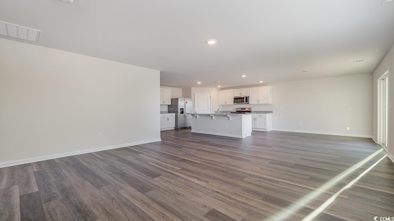 6054 Fuller Rdg Court Conway, SC 29526 - Photo 13 of 31 Unfurnished living room with dark hardwood / wood-