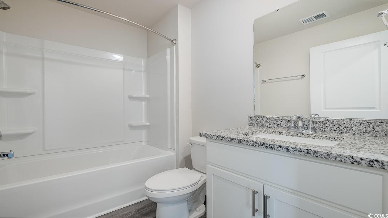 6054 Fuller Rdg Court Conway, SC 29526 - Photo 14 of 31 Full bathroom featuring vanity, wood-type flooring