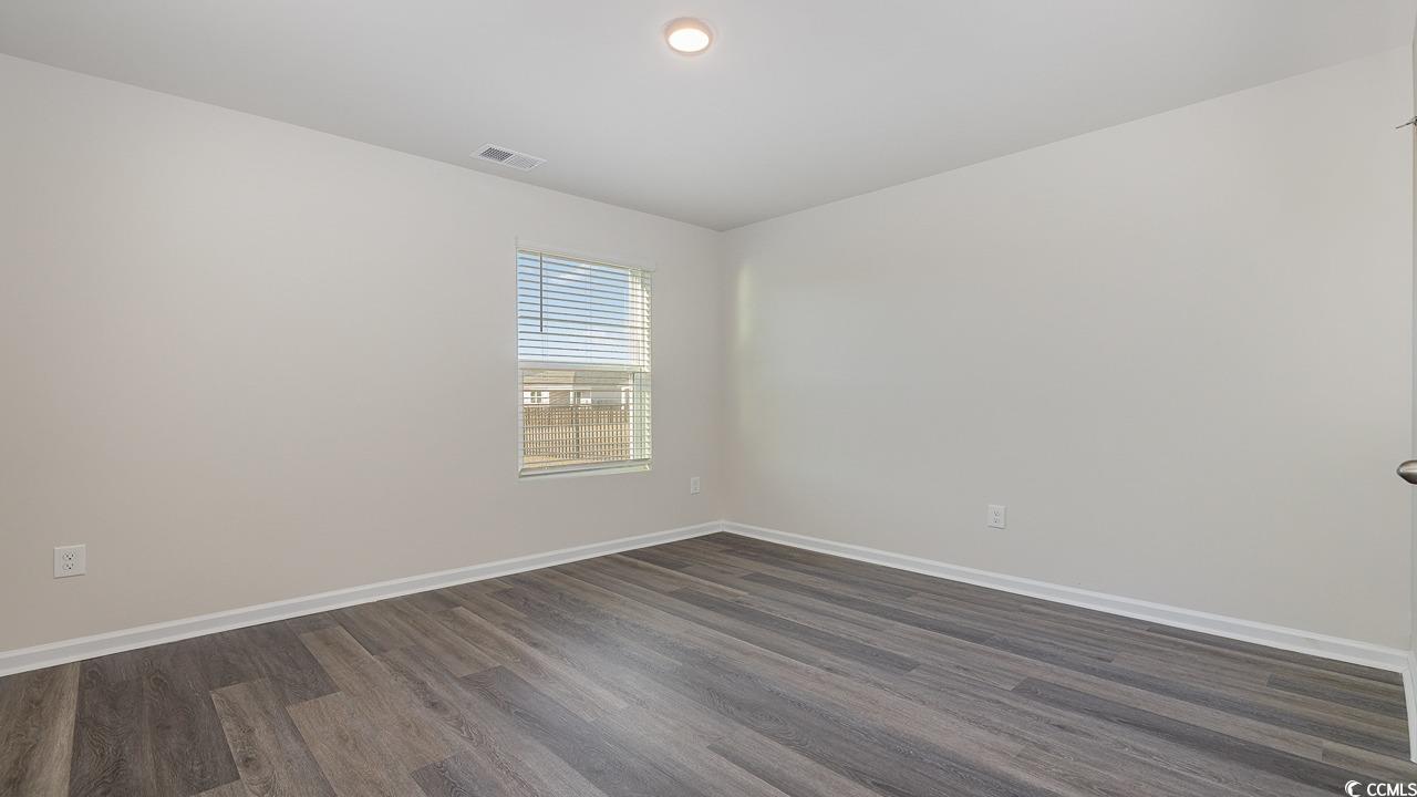 6054 Fuller Rdg Court Conway, SC 29526 - Photo 15 of 31 Spare room with dark hardwood / wood-style floorin