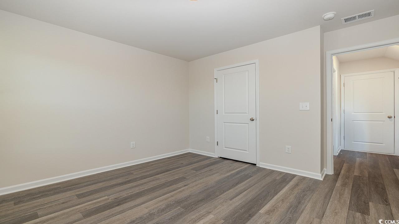 6054 Fuller Rdg Court Conway, SC 29526 - Photo 16 of 31 Unfurnished bedroom featuring dark wood-type floor