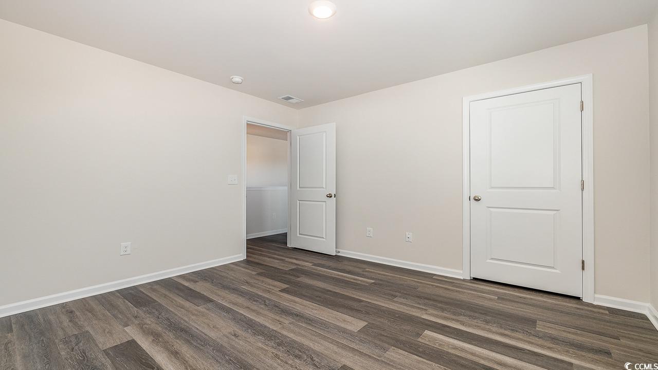 6054 Fuller Rdg Court Conway, SC 29526 - Photo 24 of 31 Unfurnished bedroom featuring dark hardwood / wood
