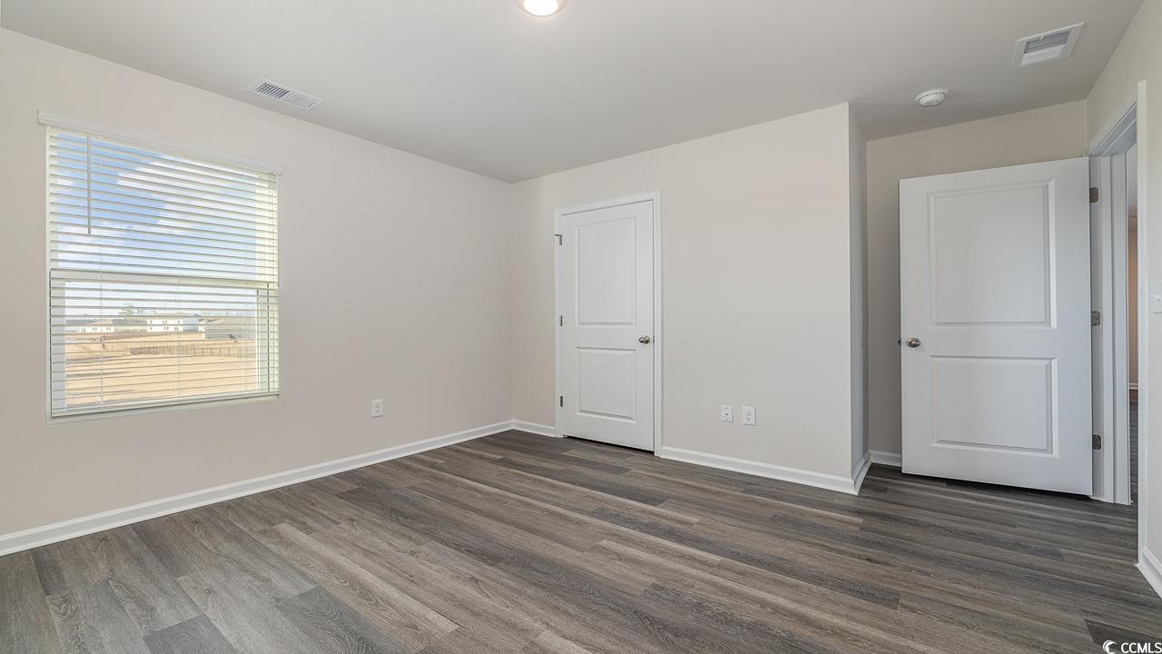 6054 Fuller Rdg Court Conway, SC 29526 - Photo 25 of 31 Unfurnished bedroom with dark hardwood / wood-styl