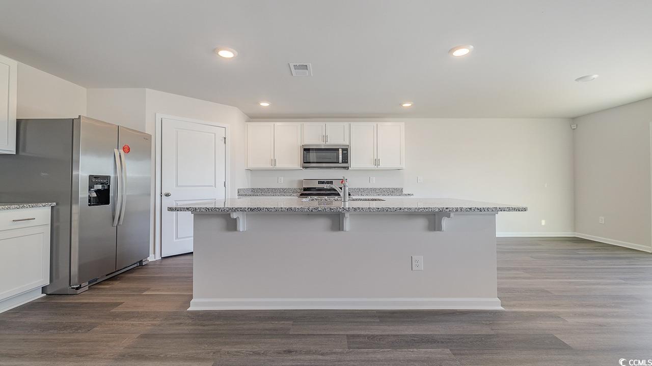 6054 Fuller Rdg Court Conway, SC 29526 - Photo 6 of 31 Kitchen featuring white cabinetry, stainless steel