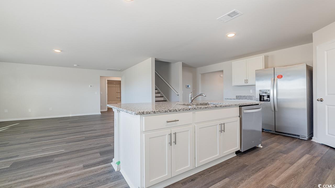 6054 Fuller Rdg Court Conway, SC 29526 - Photo 9 of 31 Kitchen with dark hardwood / wood-style floors, si