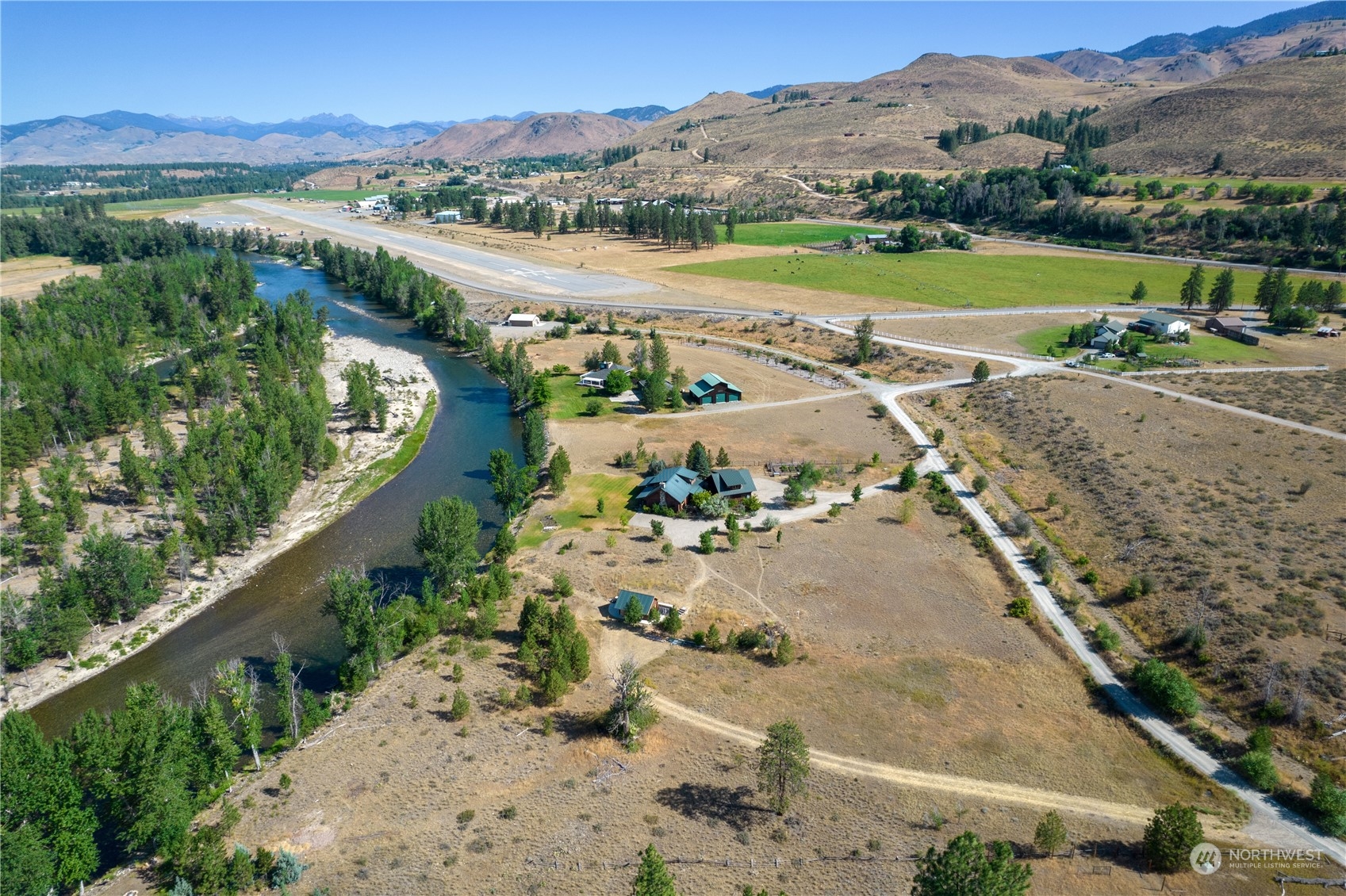 16 Lewisia Road Winthrop, WA 98862 - Photo 16 of 40 an aerial view of a city with mountains