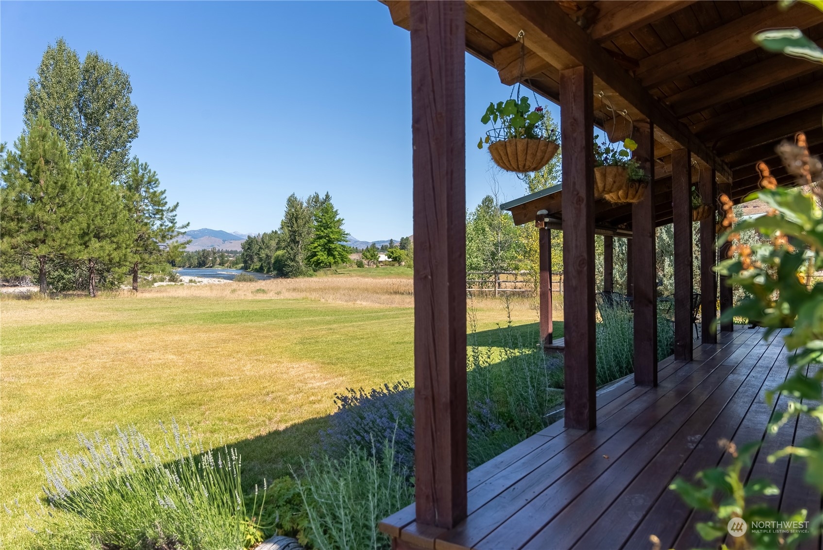 16 Lewisia Road Winthrop, WA 98862 - Photo 17 of 40 a view of a floor to ceiling window and wooden floor