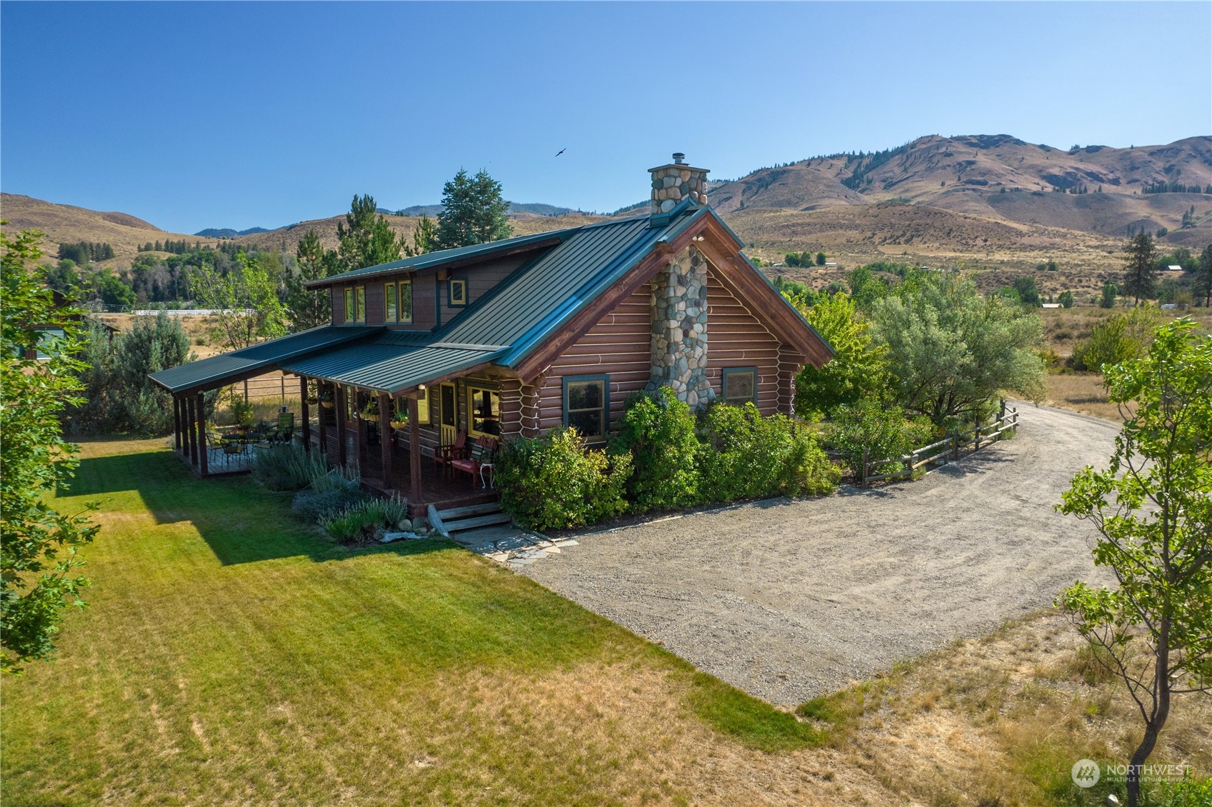 16 Lewisia Road Winthrop, WA 98862 - Photo 20 of 40 a view of a house with a yard