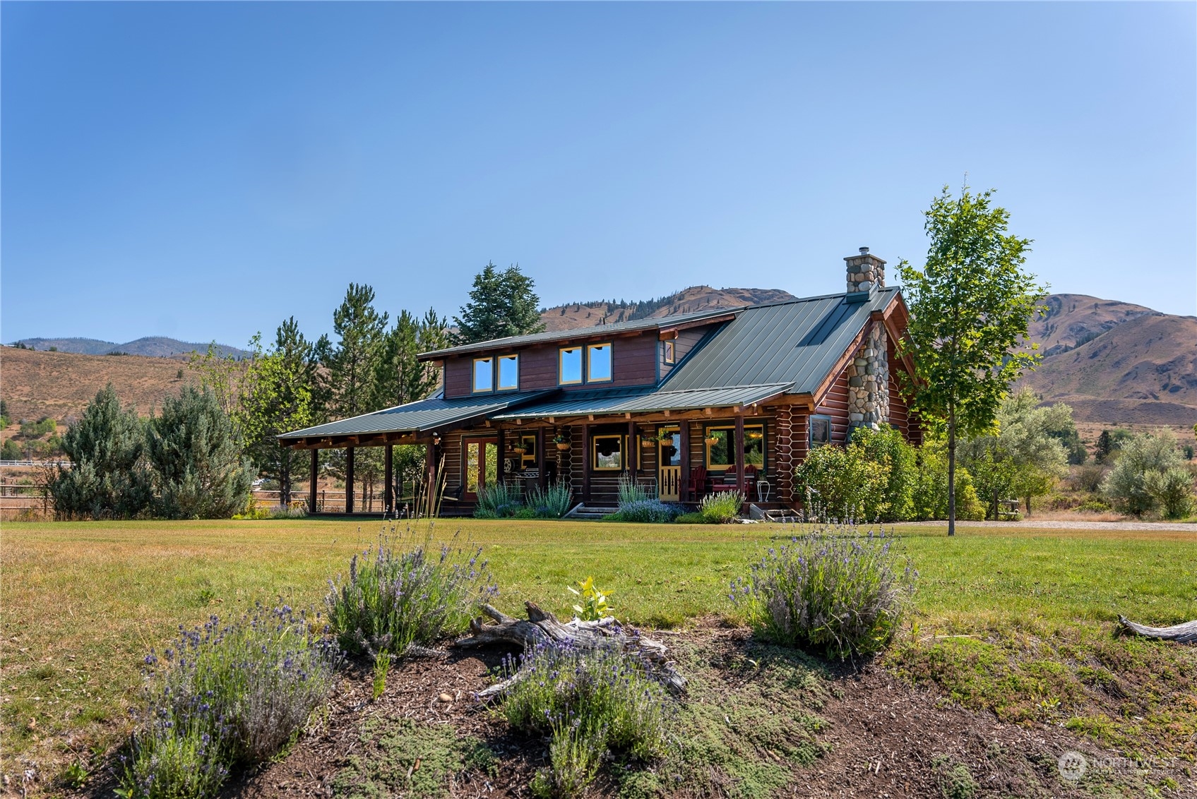 16 Lewisia Road Winthrop, WA 98862 - Photo 2 of 40 a view of a house with yard and green space