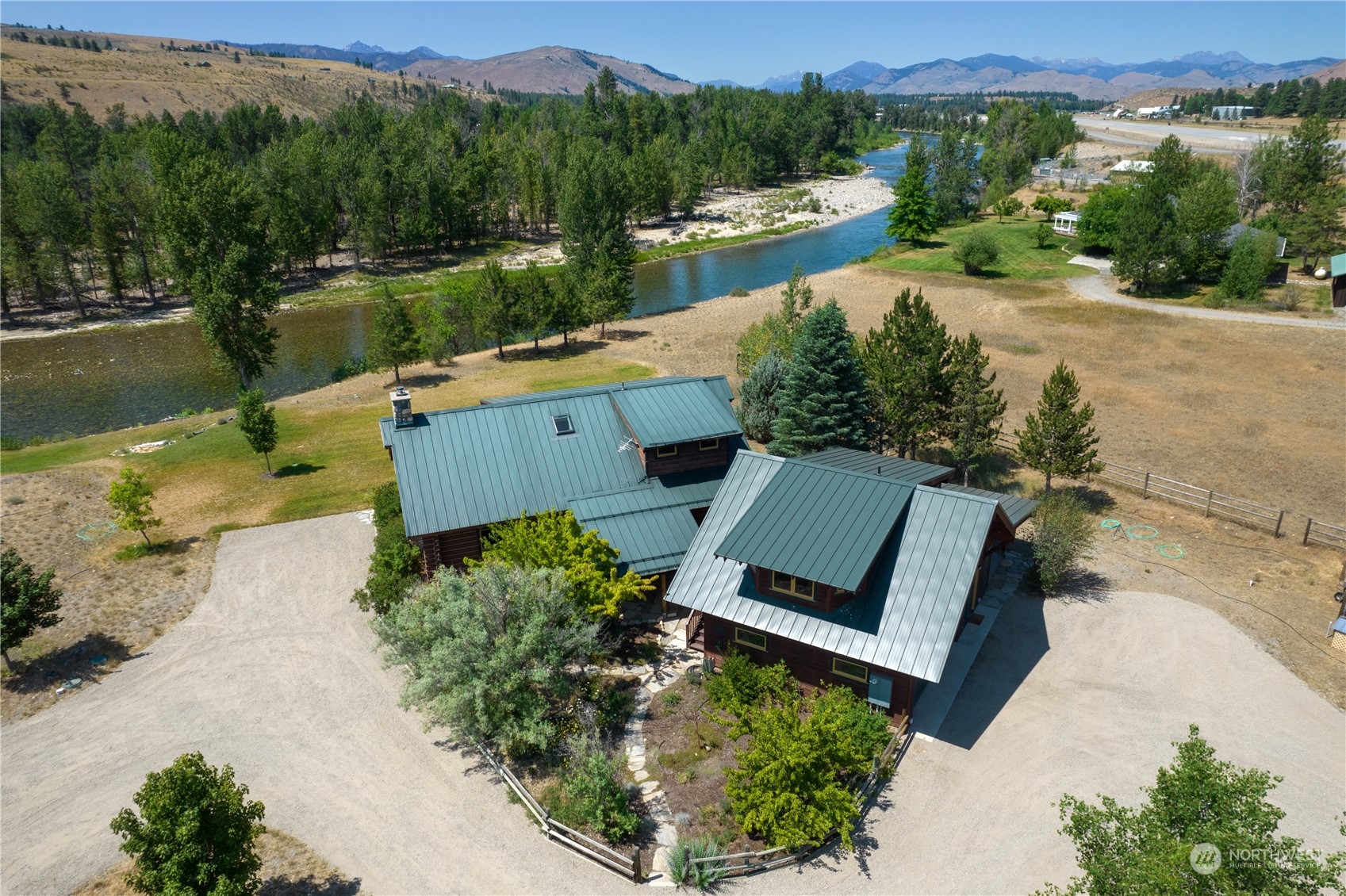 16 Lewisia Road Winthrop, WA 98862 - Photo 21 of 40 an aerial view of a house with a garden and lake view