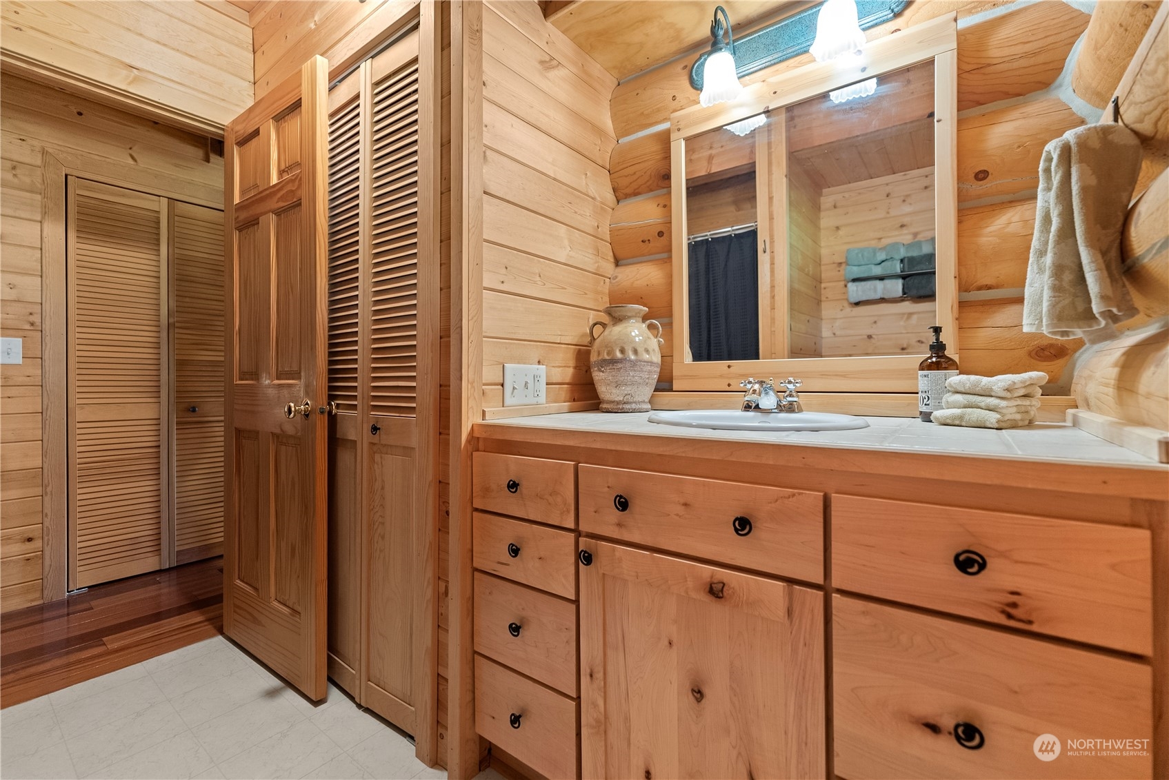 16 Lewisia Road Winthrop, WA 98862 - Photo 23 of 40 a bathroom with a sink and mirror