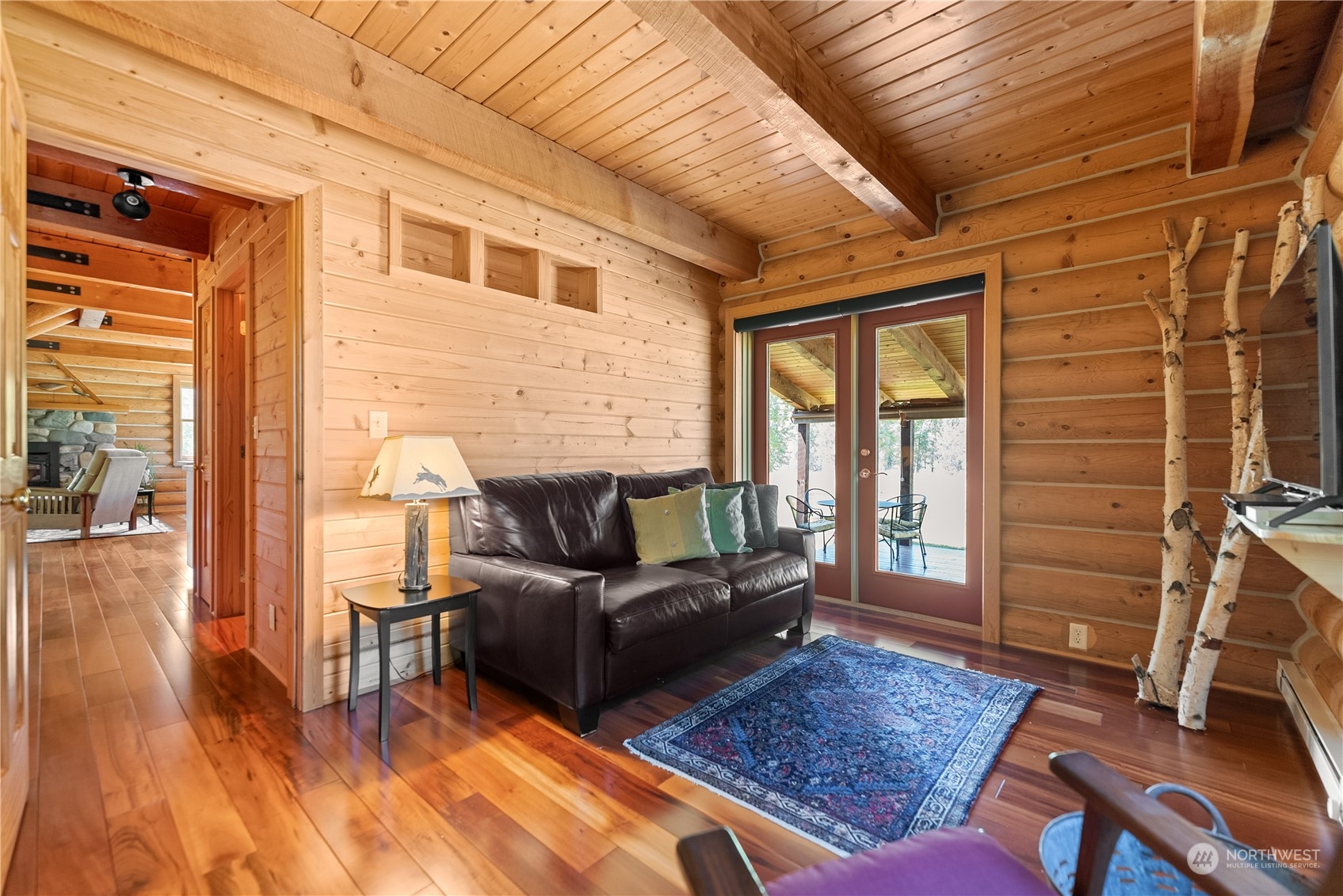16 Lewisia Road Winthrop, WA 98862 - Photo 26 of 40 a living room with furniture rug and wooden floor