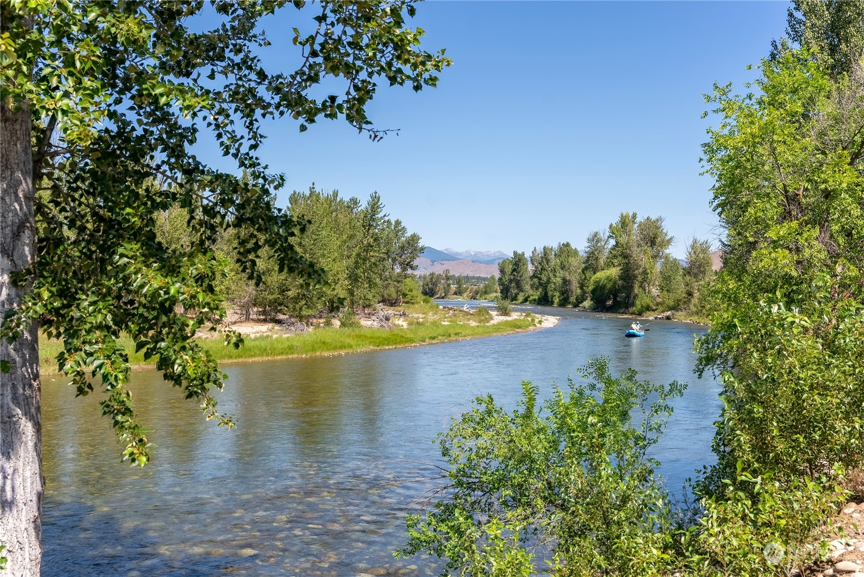 16 Lewisia Road Winthrop, WA 98862 - Photo 3 of 40 a view of a lake with houses