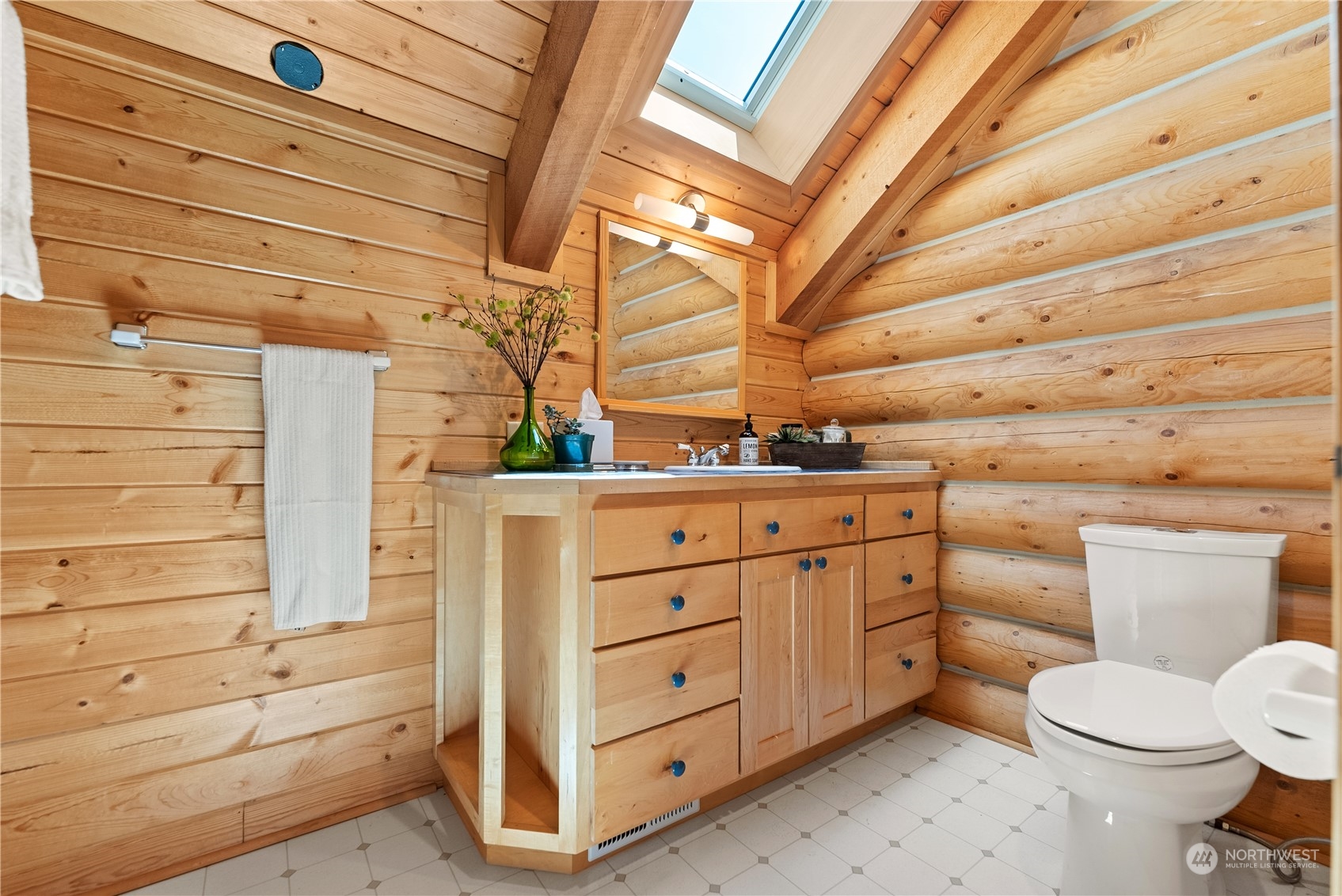 16 Lewisia Road Winthrop, WA 98862 - Photo 32 of 40 a bathroom with a sink a toilet and vanity