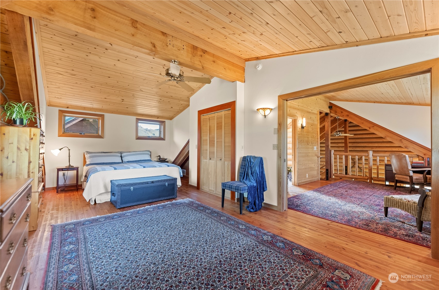 16 Lewisia Road Winthrop, WA 98862 - Photo 34 of 40 a bedroom with furniture and a large window